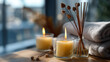 © Kateryna - Burning candles and aromatic reed freshener on surface in spa facility defocused wellness background relaxation atmosphere setting therapeutic environment display with copy
