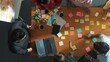 © InfiniteFlow - Top down aerial view of business people putting sticky note on whiteboard. Group of diverse people working together choosing brainstorming creative idea and placed on board at meeting. Convocation.