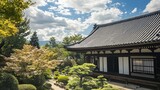 Japanese temple building with manicured garden and cloudy sky