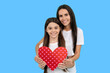 © Olena - Happy family daughter and mother. Family Valentine Day. Heart and love Valentine sign. Mom and child hold Heart for love. Loving girls family. Mothers Day. Love and family, Valentines heart.
