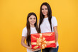 © Olena - Mother and daughter with gift. Birthday or Mothers Day.