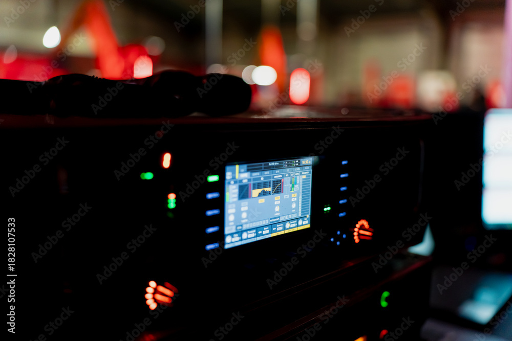 Photo Stock Electronic audio control unit with glowing interface, level ...