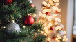 © @h.akter - Festive christmas tree closeup, adorned with red and silver ornaments on green branches, set against a blurred background of warm, glowing holiday lights, creating a cozy holiday ambiance