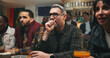 © Wess/peopleimages.com - Stress, watching tv and friends in pub for sports game with championship for entertainment together. Anxiety, live streaming and group of male fans with football match in bar for online tournament.