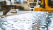 © Suphawan - High-Precision Waterjet Cutting Process in Industrial Workshop Enhancing Metal Fabrication with Close Up View of Water Stream and Metal Surface
