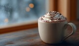 steaming cup of hot chocolate, with whipped cream and a sprinkle of cocoa powder on top
