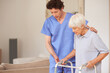 © peopleimages.com - Caregiver, helping and old woman with walker at house for support, physical therapy and aid. Volunteer, guidance and senior person with disability for assistance, mobility balance and rehabilitation