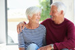 © peopleimages.com - Love, hug and happy elderly couple in home with support, connection and loyalty with partner. Smile, senior man and woman embrace in house with care, trust and marriage commitment in retirement