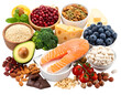 © Wawan - A variety of healthy foods including fresh fruits, vegetables, nuts, grains, cheese, and salmon arranged together