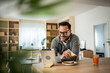 © Migma_Agency - Man enjoying breakfast during online video call at home