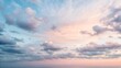 © MIkrom - Serene Pastel Sunset Sky With Wispy Clouds Over Calm Ocean Waters