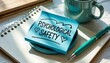 © Design Stock - Psychological safety concept written on a blue sticky note with hearts on a notebook and pen