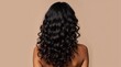 © Alex Pios - Woman with healthy shiny long curly hair view from the back, curl hairstyle
