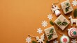 © Umer - Festive christmas arrangement with gifts ornaments and snowflakes on orange background