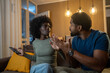 © Nenad - Young African American couple arguing.