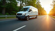 © Vadym - White delivery van rides on highway at sunset. Car drives fast on asphalt road through trees. Vehicle transports cargo on motorway. Speed motion on highway. Quick business travel concept. Van ready