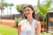 © luismolinero - Young pretty Ukrainian woman with a cornet ice cream at outdoors smiling a lot