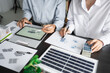 © Charlie's - Solar panels green energy Business man working green eco friendly office business creative idea Planing Bio economy for business eco friendly professional Engineer sustainable electricity.