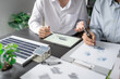 © Charlie's - Solar panels green energy Business man working green eco friendly office business creative idea Planing Bio economy for business eco friendly professional Engineer sustainable electricity.