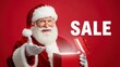 © Tatiana - Santa Claus man opening a glowing red gift box with sale text. Christmas holiday promotional offer for seasonal shopping.