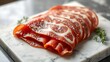 © changshan - applicability. Thinly sliced Italian cured meat on marble slab showcasing fat marbling. menu design, packaging mockups, designed for culinary blogs and recipe cards for restaurants.