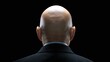 © Oleksandr - Rear view of a man's head, bald and wearing a suit, against a black background, suggesting formality, age, and perhaps authority or experience. The minimalist composition focuses