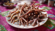 © Aloka - A plate of chicken feet is placed on the table, which has many long and thin legs made from pieces of meat. Ai generated
