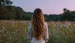 © Oleksiy - A woman with long, wavy hair stands amidst a field of flowers, her back to the viewer. She wears a white dress with a floral pattern, and her long hair cascades down her back