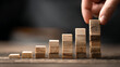 © CinimaticWorks - business development process visual with hand arranging wood blocks showing growth strategy corporate success productivity improvement and professional leadership