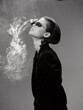 © SHOTPRIME STUDIO - Black and white portrait of a stylish woman with sunglasses exhaling smoke, dressed in a dark jacket with a minimalist background.