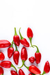 © mitsyko1971 - Vibrant red jalapeno pepper on a white background with space for text, ideal for food and culinary concepts.Group of ripe red jalapeno peppers .