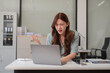 © NINENII - Stress businesswoman is sitting at table, under stress from working.