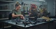 © Framestock - Military Grade Drone Assembly By Focused Female Defense Worker. Woman Assembling Military Grade FPV Drones. Concept of Refining Drones, Facility Dedicated Defense Technology and Security Innovation.