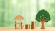 © StockNova - Wooden figures under umbrella near stacked coins and green tree family couple