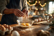 © Elvina - cracking eggs into bowl for holiday baking