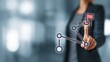 © StellaStudio - Businesswoman touching network node with flag icon via finger, connected nodes in office setting. Concept of goal achievement, network connection, business strategy and digital target tracking