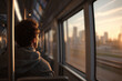 © EricMiguel - Young commuter gazing out a train window at the golden-hour city skyline — contemplative portrait of urban travel, solitude, and warm sunset light