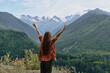 © SHOTPRIME STUDIO - Woman in mountains raising arms for freedom and nature, authenticity inclusivity