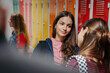 © Halfpoint - Teen students hanging out in school hallway by lockers.