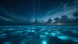 © Ashian - A stunning night sky filled with stars above calm blue ocean waters.