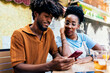 © ADDICTIVE STOCK - Young couple sharing a moment at an outdoor cafe table