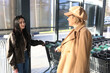 © Vasyl - Two women return with purchases from the mall.