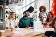 © Zamrznuti tonovi - Diverse business team collaborating during office meeting