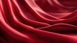 © Mrs - Close-up of flowing crimson silk fabric.  Deep folds and rich sheen