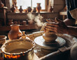© SolaruS - Artisan hands shaping clay on a spinning wheel. A metaphor for creation, skill, and tradition. Warm, earthy tones evoke craftsmanship and artistry.