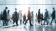 © Gautier Normand - Des personnes marchent dans un bâtiment avec un effet de flou.