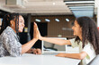 © JU.STOCKER - Mother and Daughter High Fiving After Successful Online Learning Session, African American Woman and Girl Celebrating Achievement While Using Laptop, Tutor and Student Giving High Five Over Computer