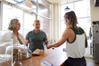 © Rob and Julia Campbell/Stocksy - Couple purchasing at local bakery