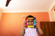 © Dream Lover/Stocksy - Toddler playing and looking happy inside home ,nice facial expression