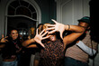 © BONNINSTUDIO/Stocksy - People dancing having fun at a live music event party